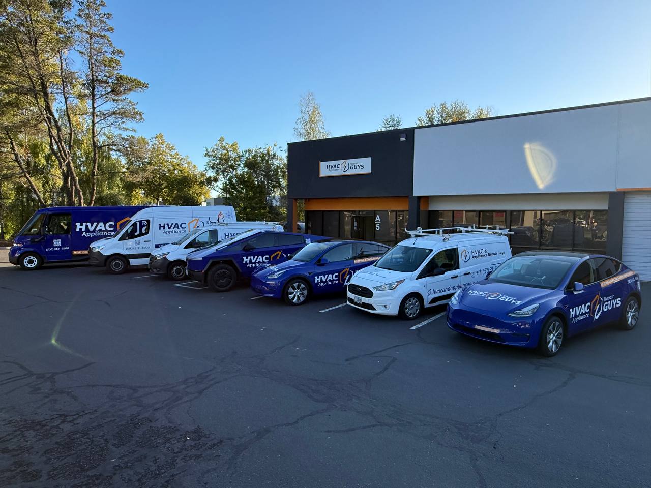 HVAC & Appliance Repair Guys service fleet outside the Portland office