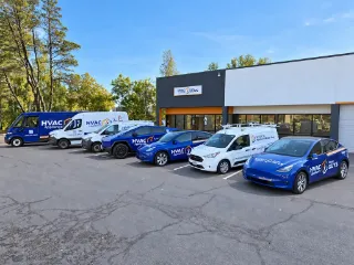 HVAC & Appliance Repair Guys service fleet outside the Portland office